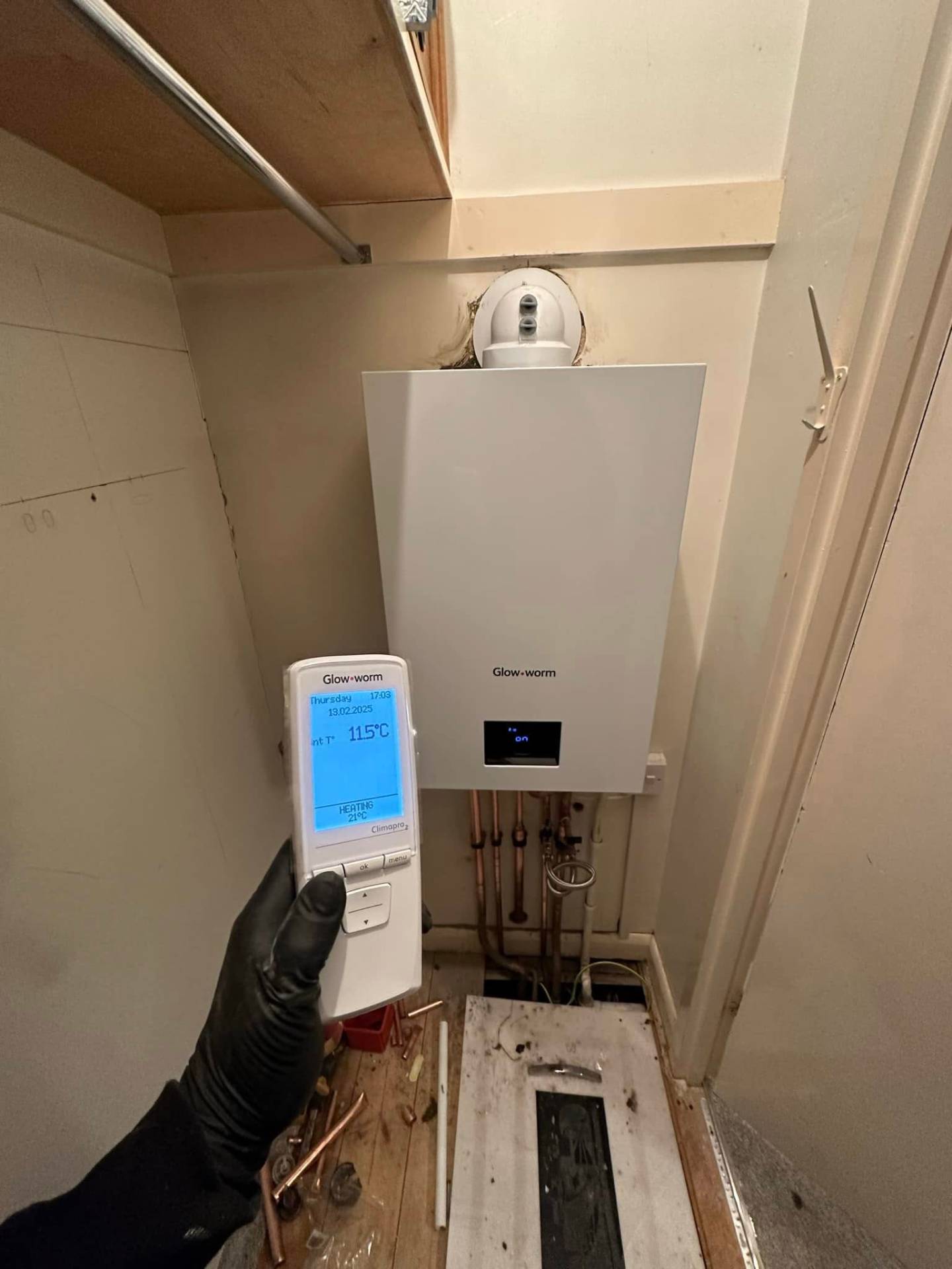 Glow-worm boiler commissioning with Climapro 2 wireless thermostat in a Northampton airing cupboard