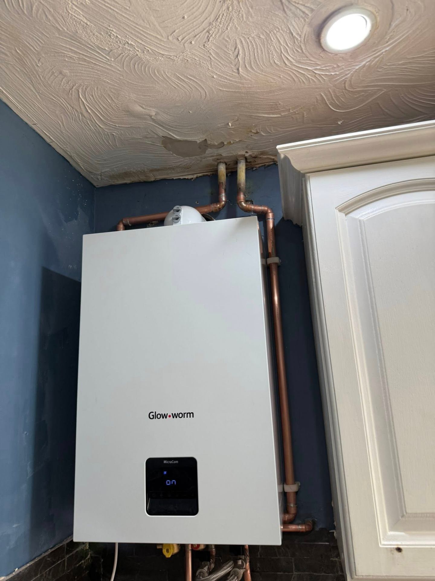 Glow-worm boiler swap with new copper pipework in a utility room in Daventry