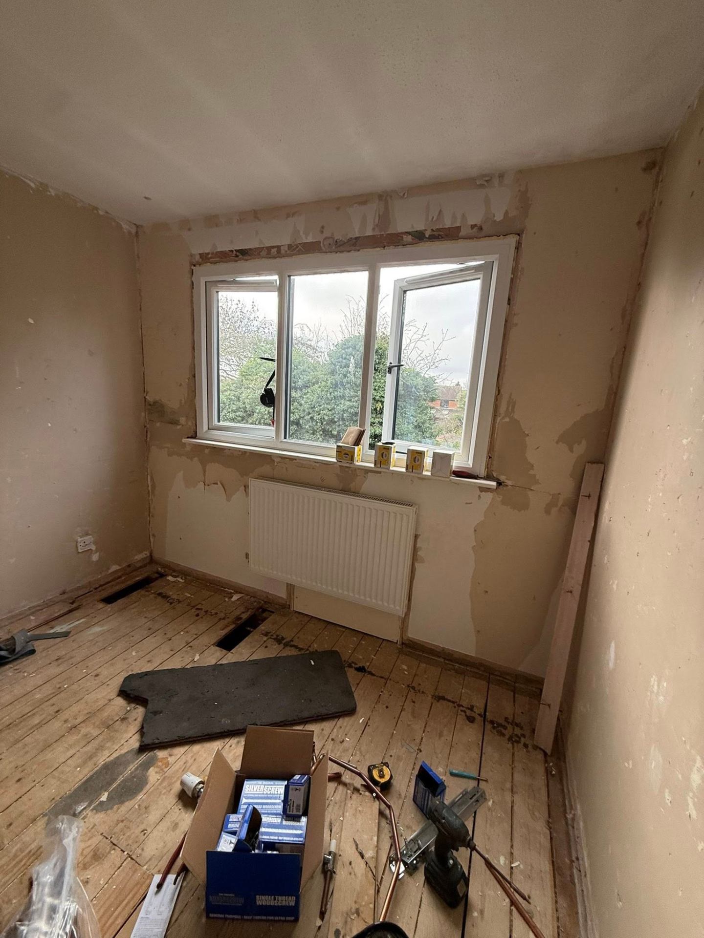 Central heating strip-out and radiator removal during a full bedroom refurbishment in Northampton